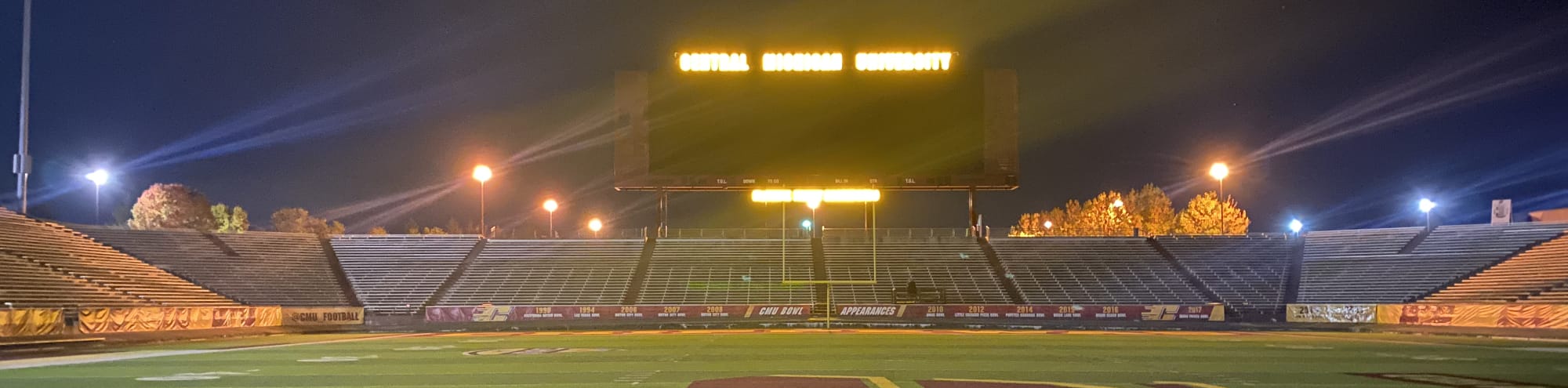 empty football stadium at night under the lights Hartford